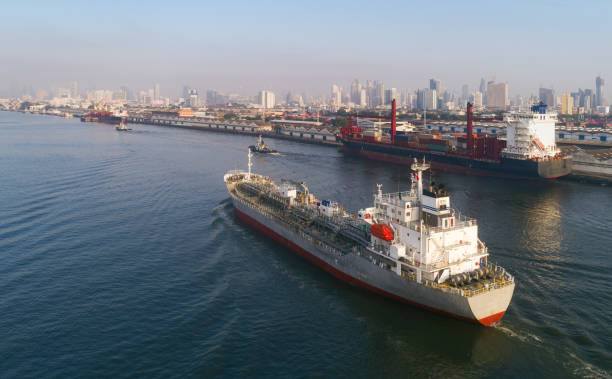 Oil ship tanker transportation oil from refinery with cityscape background. Oil ship tanker transportation oil from refinery with cityscape background.
