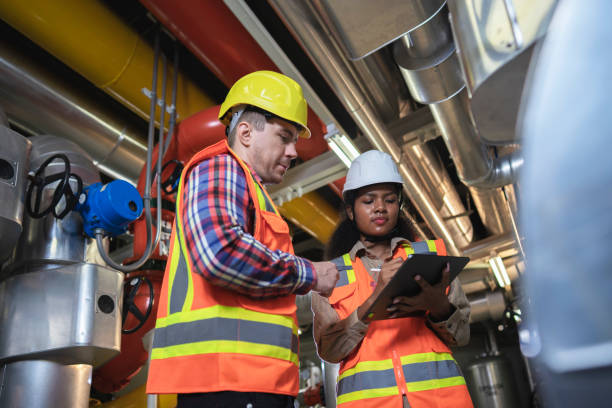 Technician engineer working in industrial plant by checking
